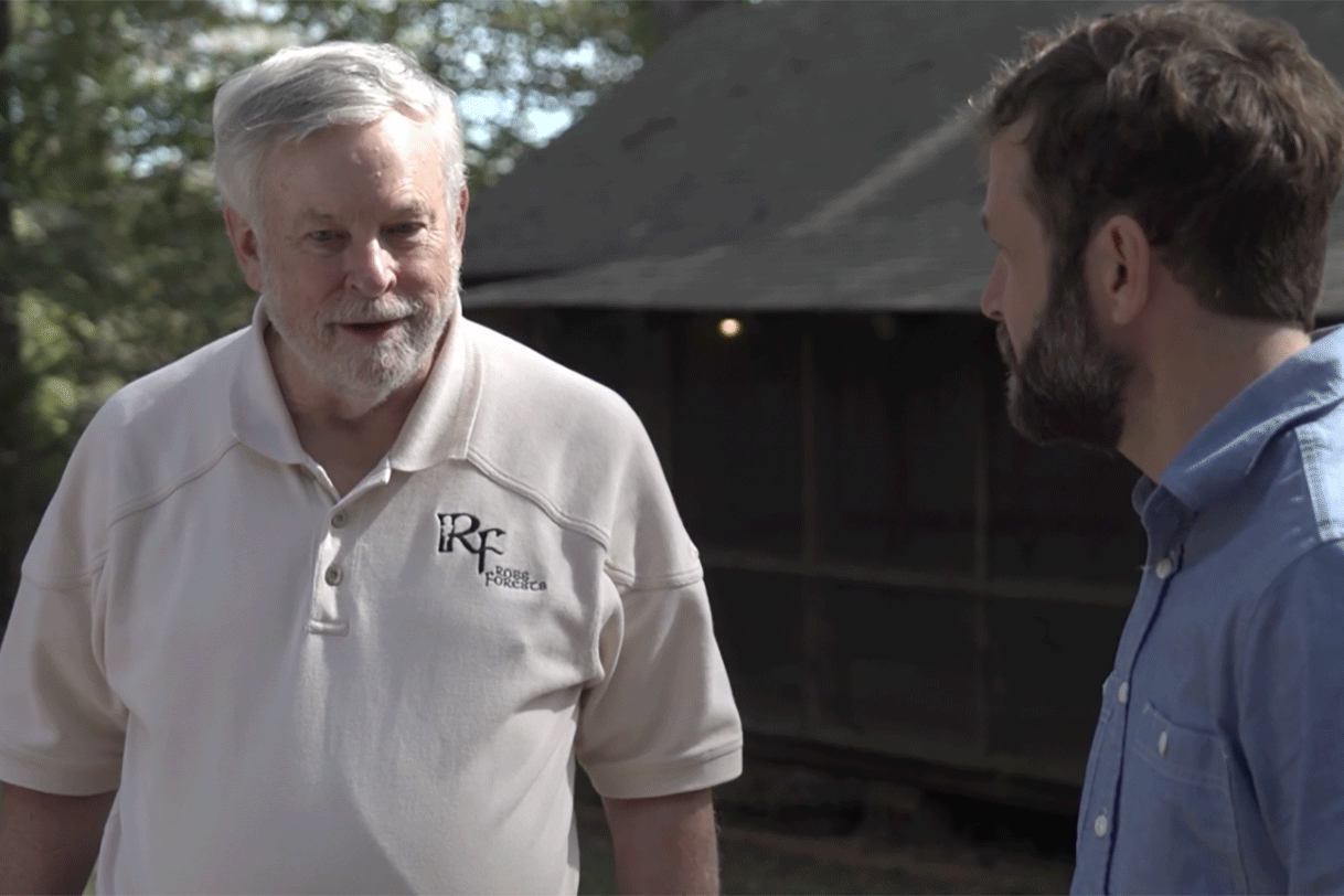 Tennessee landowner John Ross and NCX CEO Zack Parisa talk in the forest